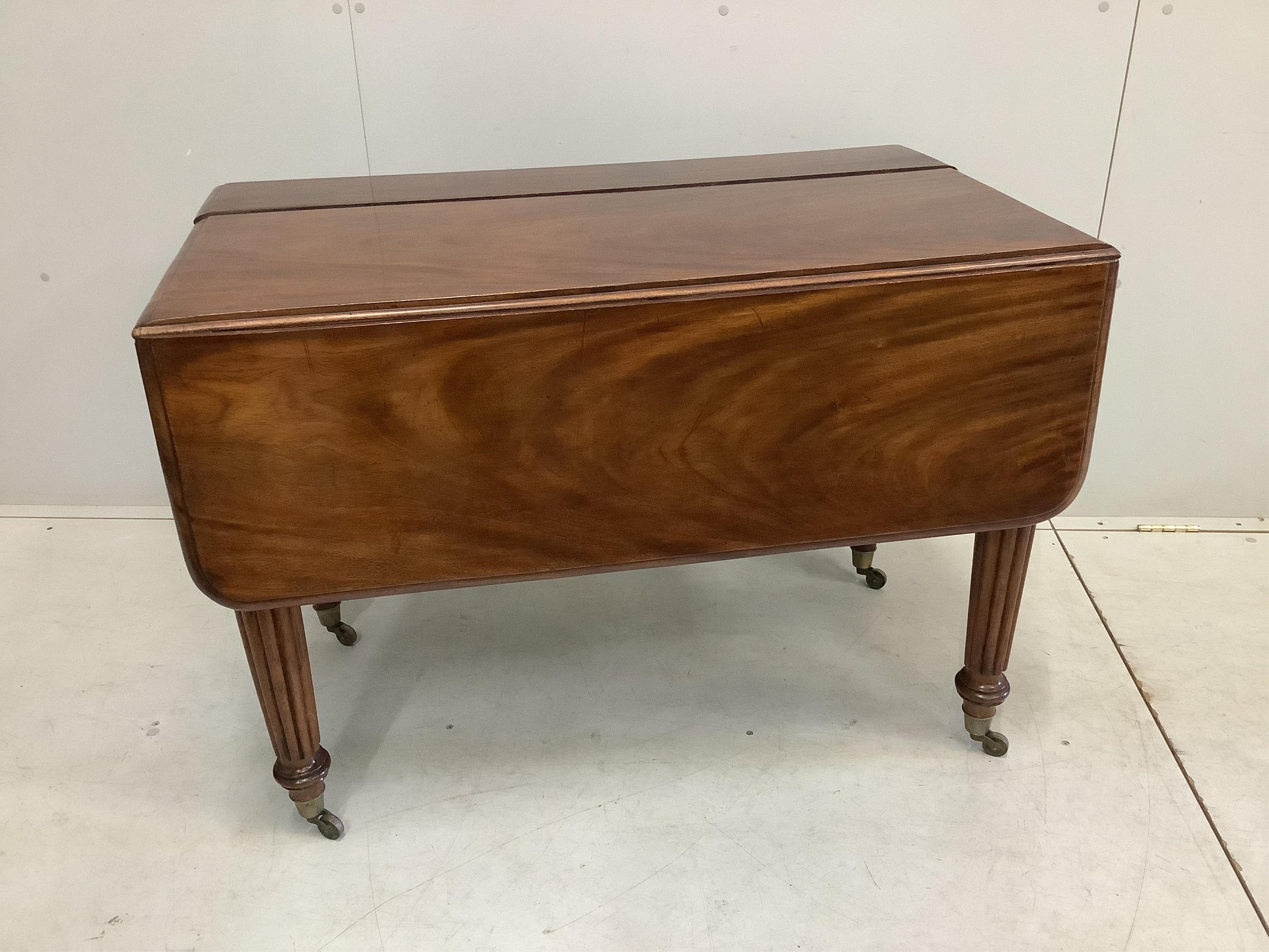 A George IV mahogany drop flap extending dining table, width 228cm extended, two spare leaves, depth 102cm, height 73cm